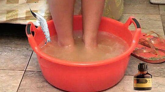 Taking a warm bath with iodine is one of the steps in the treatment of toenail fungus